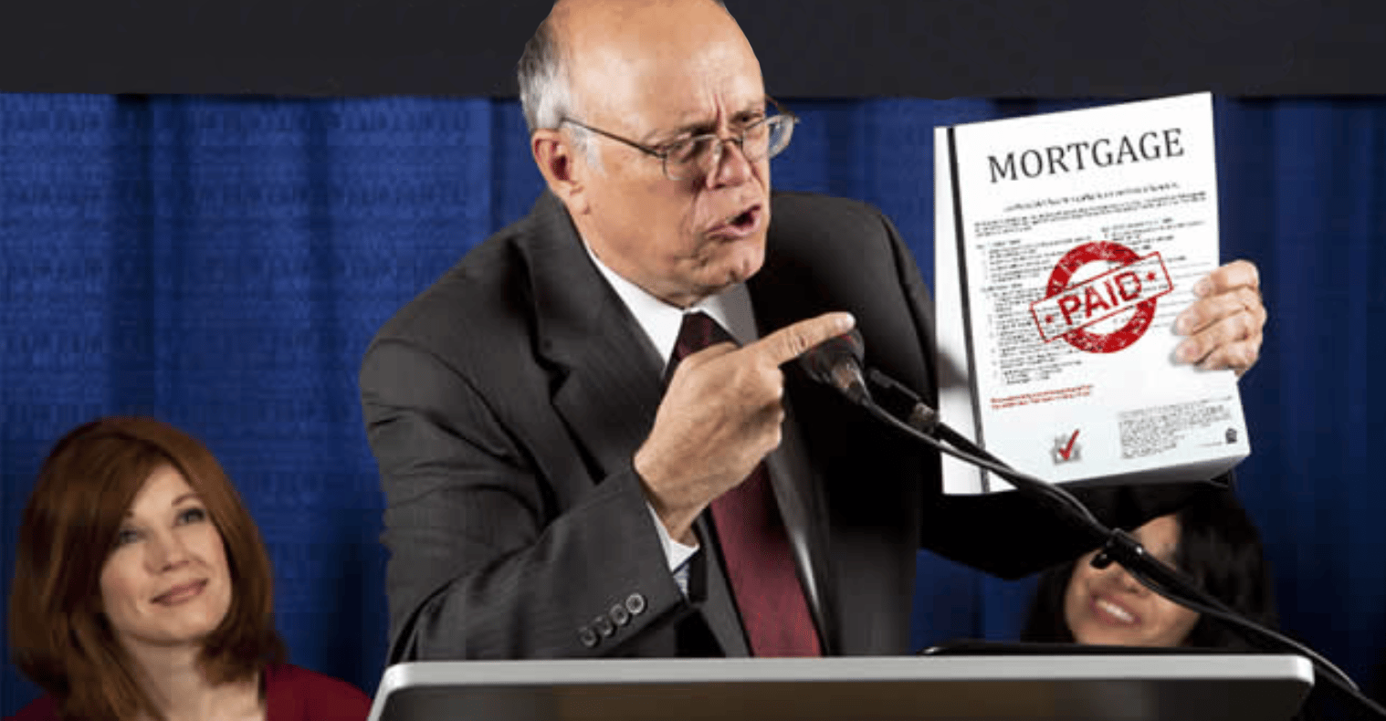 Man holding paid mortgage